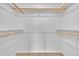 Empty closet with shelving and neutral carpet at 215 Longview Dr, Smithfield, NC 27577