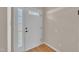 Bright entryway featuring a white door with glass inserts, complemented by neutral wall paint and wood flooring at 215 Longview Dr, Smithfield, NC 27577