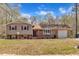 Charming home featuring a blend of brick and siding, with a well-maintained lawn and attached garage at 215 Longview Dr, Smithfield, NC 27577