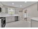 Renovated kitchen provides stainless appliances, gray cabinets, and eat-in dining space at 215 Longview Dr, Smithfield, NC 27577
