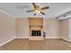 Open living room featuring a brick fireplace with a decorative mantle at 215 Longview Dr, Smithfield, NC 27577