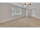 Inviting living room featuring neutral carpet, a bright bay window and an open floor plan at 215 Longview Dr, Smithfield, NC 27577