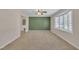Spacious living room with neutral carpet, ceiling fan, and a large bay window providing natural light at 215 Longview Dr, Smithfield, NC 27577