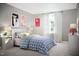 Whimsical bedroom with llama-themed art, patterned bedding, and soft lighting, creating a fun and inviting space at 221 N Coral Bells Way, Four Oaks, NC 27524