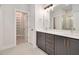 Modern bathroom with double vanity, quartz countertop, and walk-in closet for optimal storage at 2212 Edwin Ave # A, Durham, NC 27705
