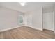 Comfortable bedroom with hardwood floors, a window, and a closet at 2212 Edwin Ave # A, Durham, NC 27705