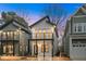 Charming two-story new home with a balcony and modern design elements, framed by neighboring houses at 2212 Edwin Ave # A, Durham, NC 27705