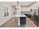 Spacious kitchen with a long island, stainless steel appliances, and hardwood floors at 2212 Edwin Ave # A, Durham, NC 27705