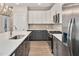 Modern kitchen with stainless steel appliances, two-tone cabinets, and quartz countertops at 2212 Edwin Ave # A, Durham, NC 27705