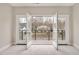 Bright living room with French doors opening to a small balcony overlooking the neighborhood at 2212 Edwin Ave # A, Durham, NC 27705