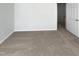 This bedroom features neutral carpeting and light gray walls at 23 Round Spring Ln, Durham, NC 27712