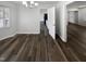 Dining room with chandelier, and modern flooring at 23 Round Spring Ln, Durham, NC 27712
