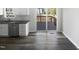 This kitchen features a stainless steel dishwasher, a sink, and white cabinets at 23 Round Spring Ln, Durham, NC 27712
