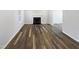 Spacious living room features hardwood flooring and a fireplace at 23 Round Spring Ln, Durham, NC 27712