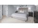 Cozy bedroom featuring soft lighting, a plush bed and neutral color palette at 231 N Coral Bells Way, Four Oaks, NC 27524