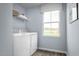 Functional laundry room with modern washer, dryer, and natural light at 231 N Coral Bells Way, Four Oaks, NC 27524
