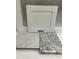 Bathroom remodel sample featuring a white cabinet and two types of stone countertops at 25 Bold Dr, Youngsville, NC 27596