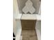 Bathroom remodel sample featuring hexagon tiles, a stone countertop, and a wooden cabinet at 25 Bold Dr, Youngsville, NC 27596