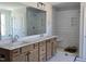 Bathroom featuring a double sink vanity and a white tiled shower with a built in bench at 25 Bold Dr, Youngsville, NC 27596