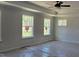 This is a primary bedroom featuring a tray ceiling and three windows at 25 Bold Dr, Youngsville, NC 27596
