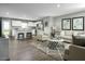 Inviting living room with comfortable seating, stylish decor, and an open layout to the kitchen at 254 N Coral Bells Way, Four Oaks, NC 27524