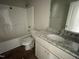Bathroom featuring a shower-tub combo, granite vanity, and modern fixtures at 26 Harvest Hills Ln, Dunn, NC 28334