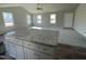 Open concept kitchen with granite island and stainless appliances at 26 Harvest Hills Ln, Dunn, NC 28334