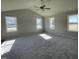 Spacious living room with vaulted ceilings and ample natural light from multiple windows at 26 Harvest Hills Ln, Dunn, NC 28334
