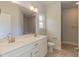 Bathroom with double vanity and granite countertops at 26 Northwood Dr, Fuquay Varina, NC 27526