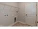 Practical laundry room featuring tile flooring, utility sink, and shelving at 26 Northwood Dr, Fuquay Varina, NC 27526