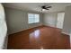 Bedroom featuring hardwood floors, neutral gray walls, and a ceiling fan at 2616 Firelight Rd, Raleigh, NC 27610