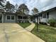 A charming single-story home with a well-maintained lawn and inviting walkway to the front door at 2616 Firelight Rd, Raleigh, NC 27610