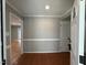 Inviting foyer with warm hardwood floors and elegant wall trim, leading into the home at 2616 Firelight Rd, Raleigh, NC 27610