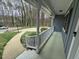 Charming covered front porch with white railings, offering curb appeal and a relaxing outdoor space at 2616 Firelight Rd, Raleigh, NC 27610