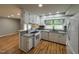 Bright, functional kitchen featuring granite countertops, white appliances, and open layout for easy entertaining at 2616 Firelight Rd, Raleigh, NC 27610
