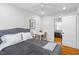 Relaxing bedroom features hardwood floors, a window and closet with mirrored door at 2706 Mcneil St St, Raleigh, NC 27608