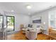 Inviting living room with hardwood floors, neutral paint, and comfortable seating arrangement at 2706 Mcneil St St, Raleigh, NC 27608