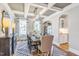 Elegant dining room featuring coffered ceilings, hardwood floors, and large windows with scenic views at 307 Augusta Pond Way # 167, Raleigh, NC 27603