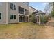 Backyard featuring a screened porch and charming playhouse at 3108 Bluff Oak Dr, Cary, NC 27519