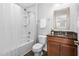 Bathroom features shower and tub, granite counters, and warm brown vanity at 3108 Bluff Oak Dr, Cary, NC 27519