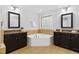 Bathroom features double vanity sinks and corner tub at 3108 Bluff Oak Dr, Cary, NC 27519