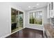Bright breakfast nook features sliding glass doors to a deck and a large window with wooded views at 3108 Bluff Oak Dr, Cary, NC 27519