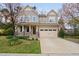 Charming two-story home with a well-manicured lawn and an attached two-car garage at 3108 Bluff Oak Dr, Cary, NC 27519