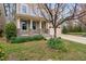 Attractive home exterior featuring a two-car garage and landscaped front yard with blooming plants at 3108 Bluff Oak Dr, Cary, NC 27519