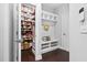 Charming hallway with storage shelves, coat hooks, and access to the pantry at 3108 Bluff Oak Dr, Cary, NC 27519