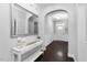 Welcoming hallway with dark wood floors, white trim, and an elegant console table at 3108 Bluff Oak Dr, Cary, NC 27519