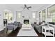 Cozy living room with a fireplace, dark wood floors, and ample natural light at 3108 Bluff Oak Dr, Cary, NC 27519