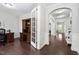 Bright office space with elegant French doors, wood floors, and views of the hallway at 3108 Bluff Oak Dr, Cary, NC 27519