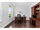 Home office features a dark wood desk and a built-in cabinet with shelving at 3108 Bluff Oak Dr, Cary, NC 27519