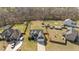 Spacious home boasts a large, fenced yard with mature trees and storage sheds at 36 Deep Woods Ln, Cameron, NC 28326